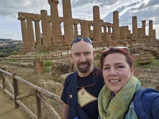 Dr. Collada and his wife, Debra, stand in front of ancient ruins.