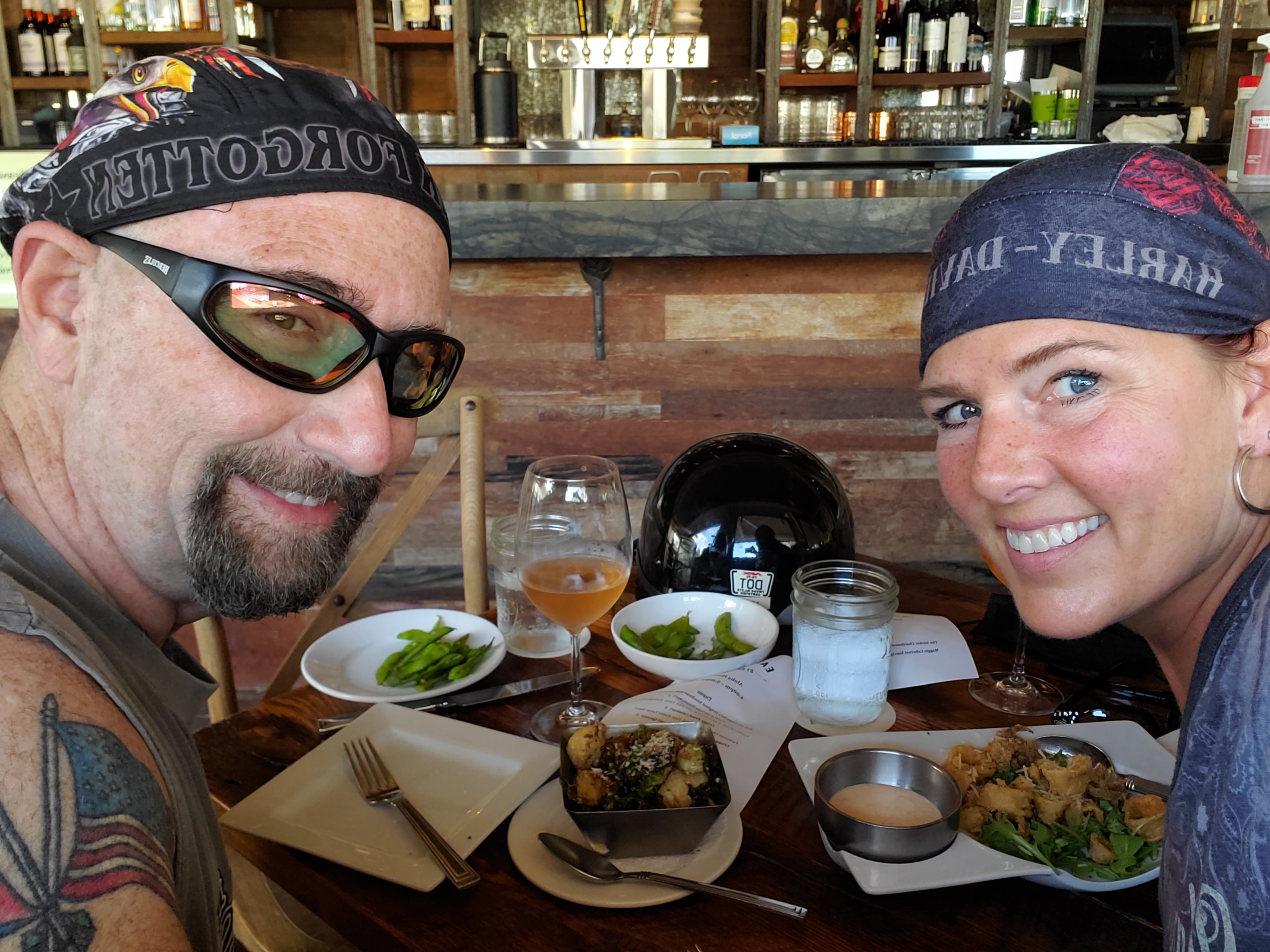 Dr. Collada and his wife, Debra, share dinner at a restaurant.