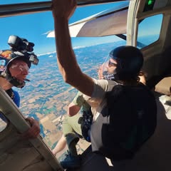 Dr. Collada buddy skydives with his wife, Debra.