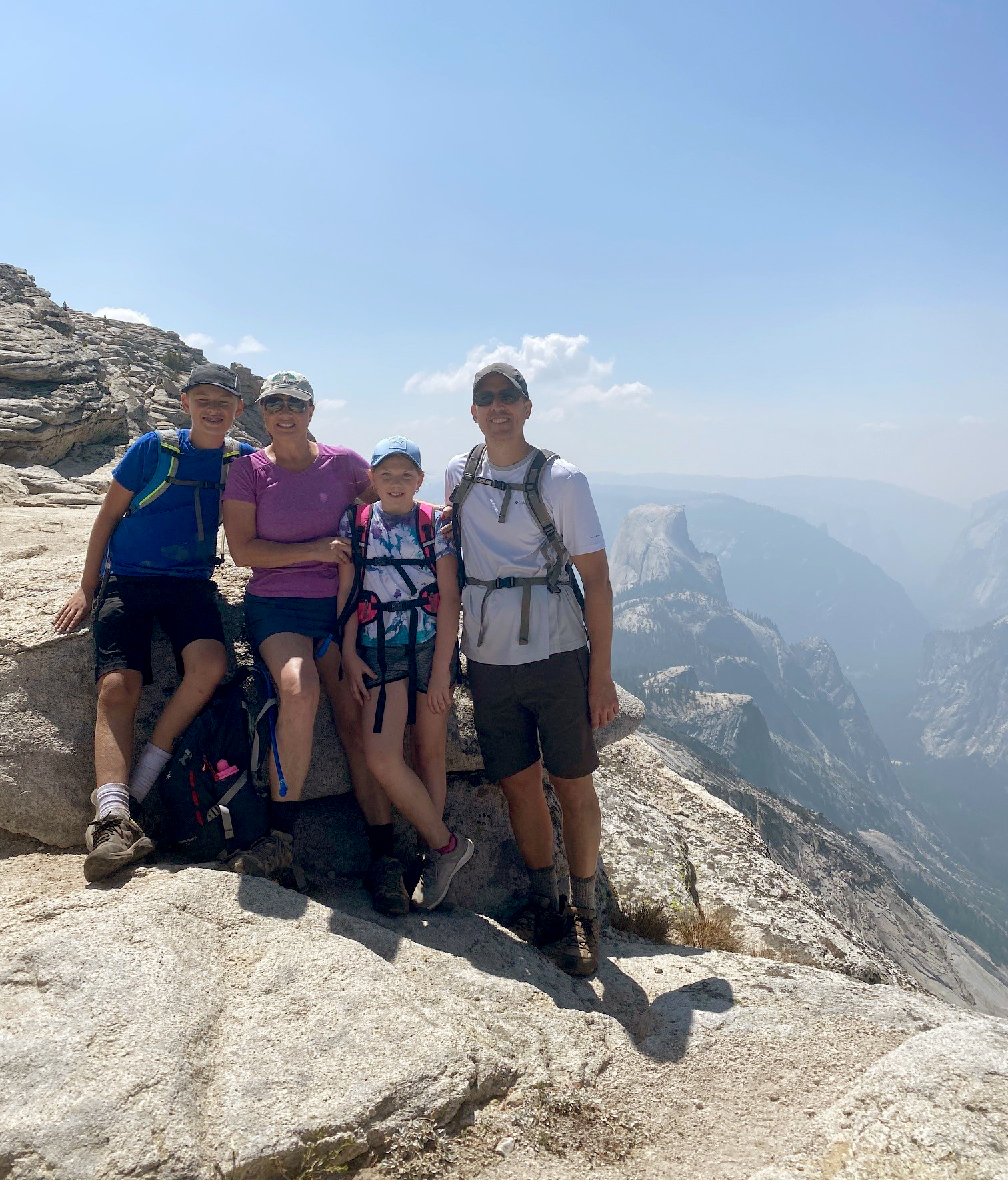 Eric Laro, MD, with his family at Yosemite, Half Dome in the distance.