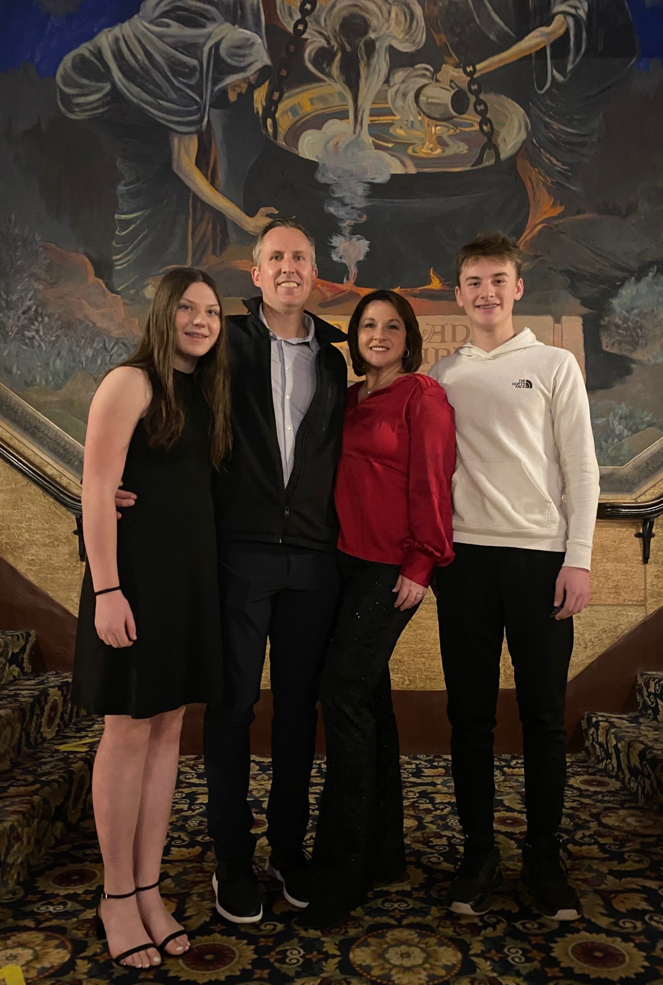 Eric Laro, MD, with his family in a formal setting.