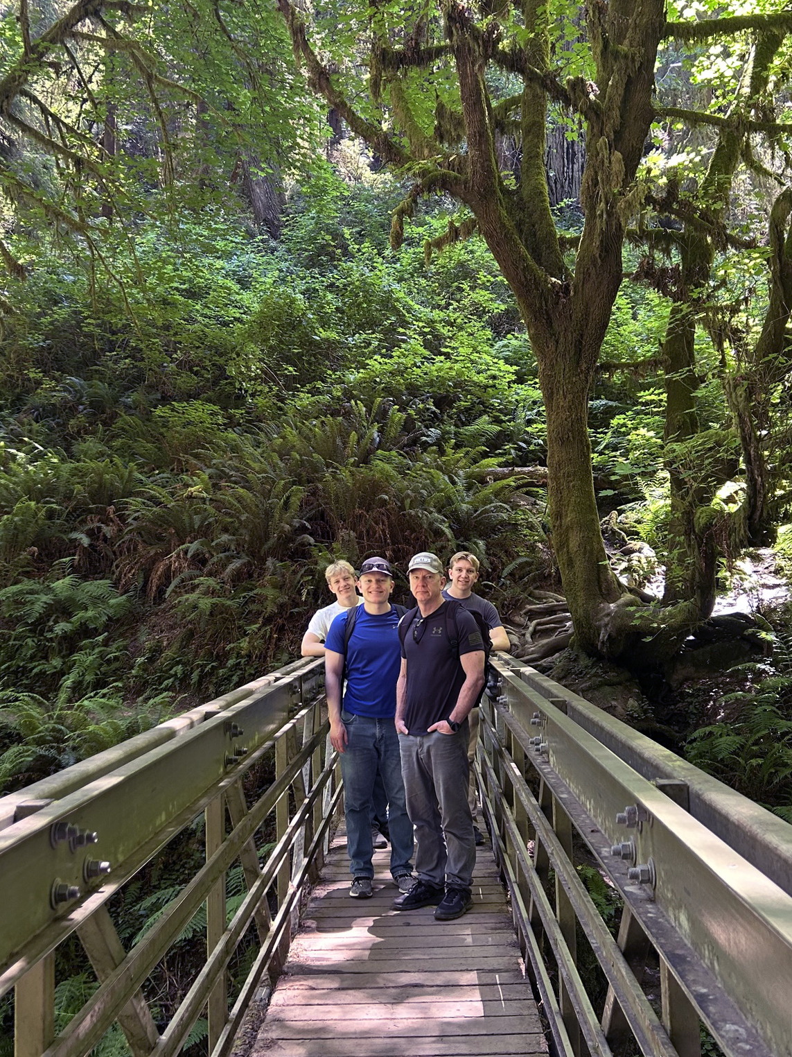 Dr. Mikeska with his three sons on a bridge in Yosemite National Park.