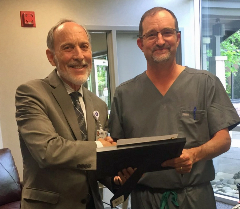 Dr. Yates gives Dr. Eyre star award