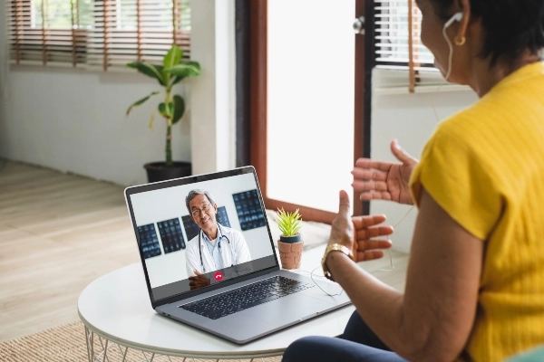 Woman doing a video visit with a provider