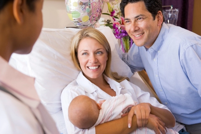 Family talking with doctor after labor