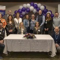 Leaders from both hospital systems pose for a group shot at the signing event on Jan. 20, 2026.
