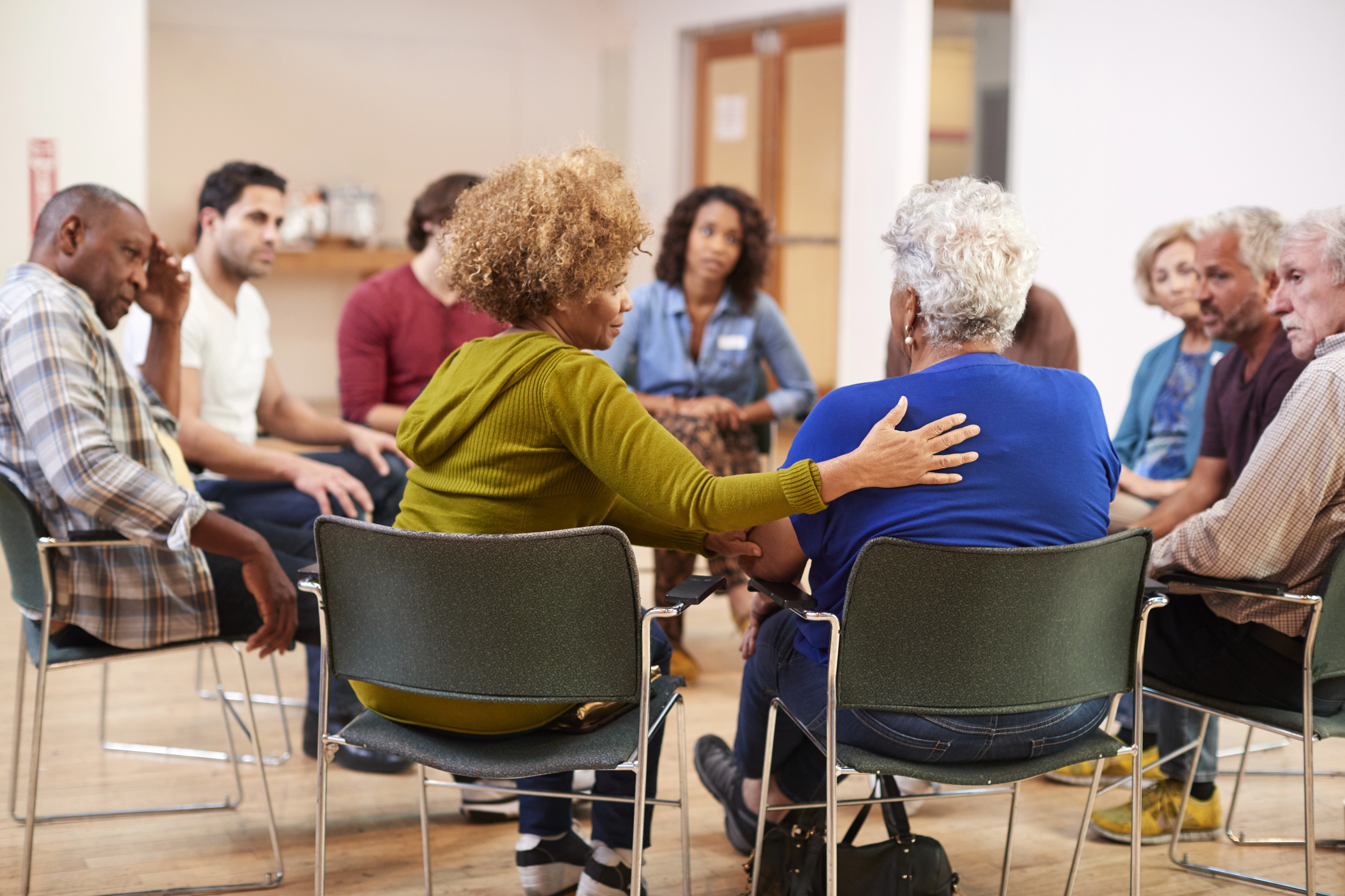 People sitting in a circle while talking