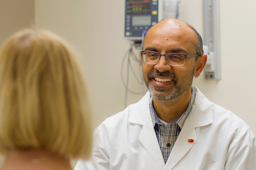 Dr. Nair meeting with patient