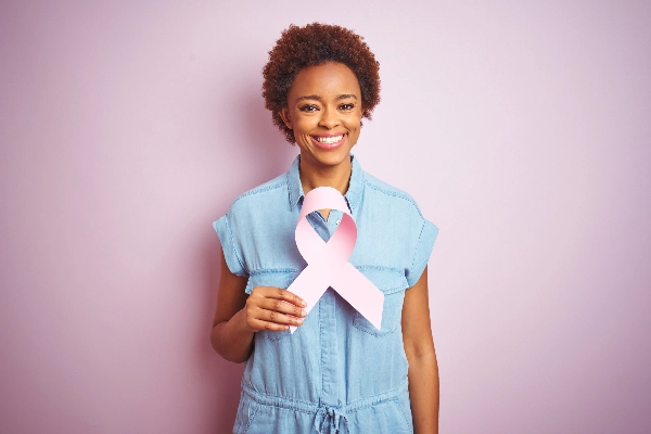 Woman holding breast cancer ribbon