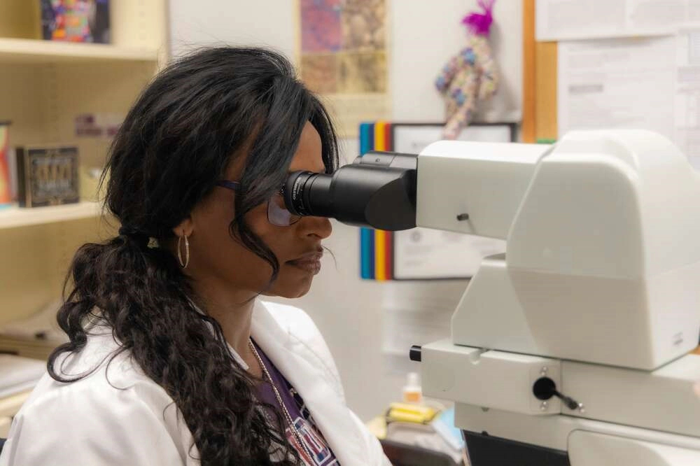 Pathology doctor using microscope