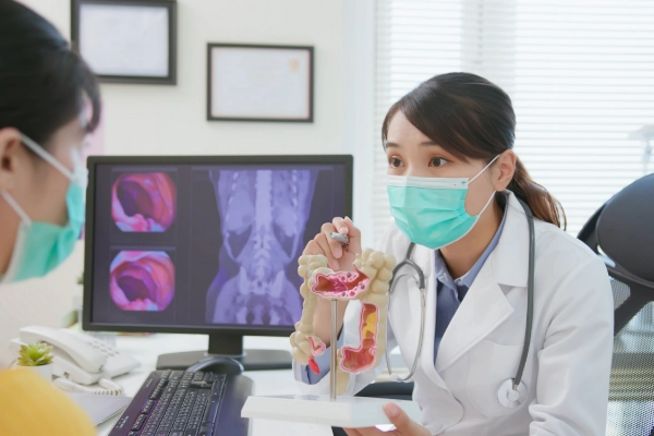 Doctor talking with a patient about the benefits of colon cancer screening.