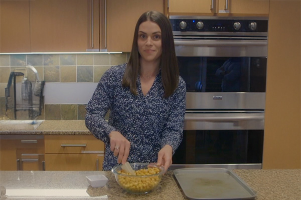 Salem Health dietitian mixing a bowl of chickpeas