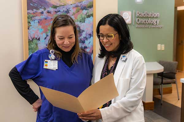 Dr. Reyes-Molyneux with a staff member