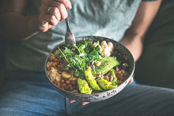 Healthy bowl of greens and legumes