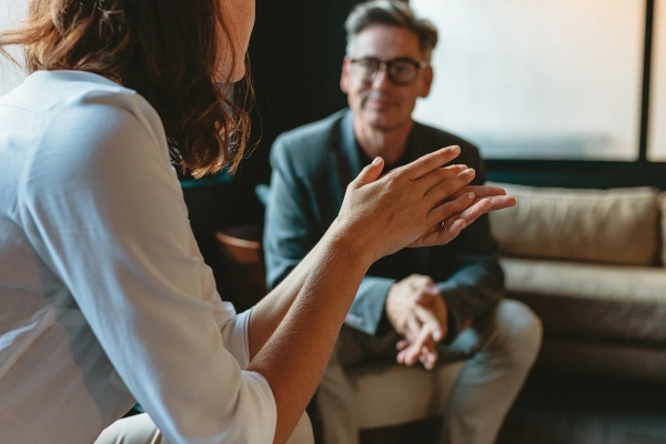 Man and woman talking in an office