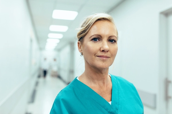 Nurse standing in hospital hallway