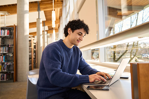 Male student in a library