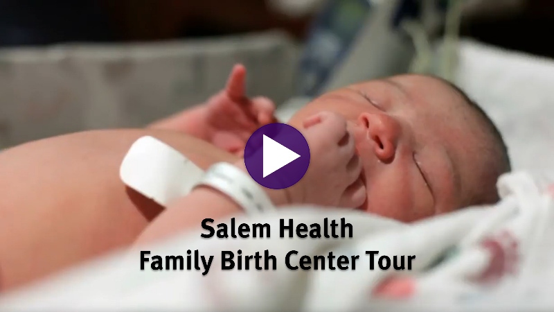 Newborn baby resting in a hospital room.