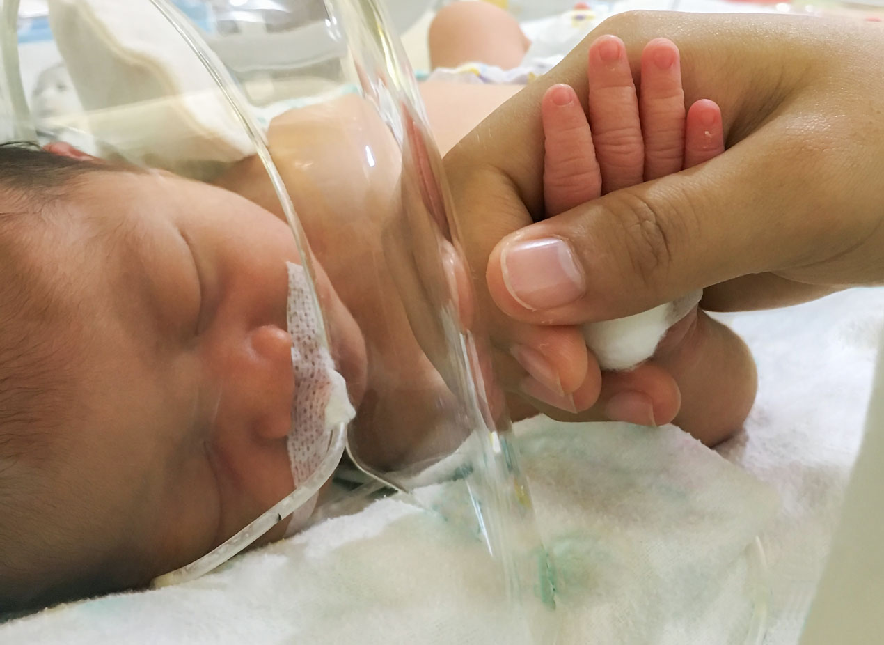 NICU baby with parent