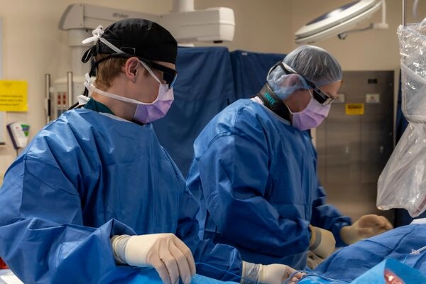 Cath lab surgeons doing a procedure on a patient