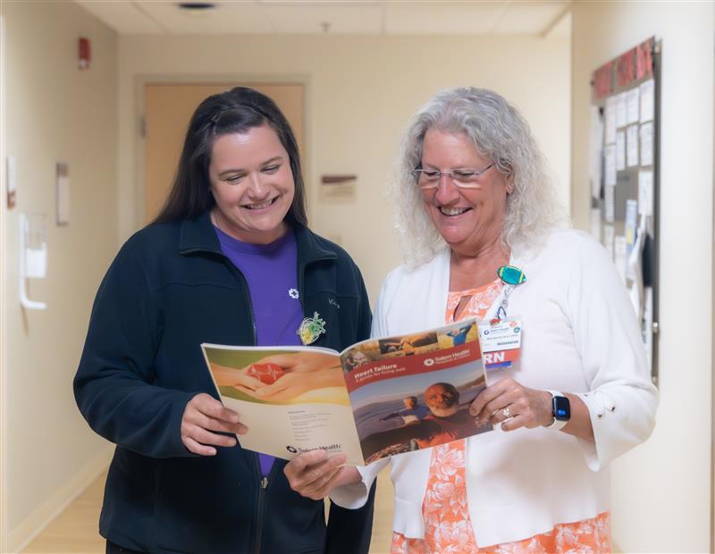 Nurse navigators reviewing patient education materials