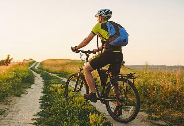 Man mountain biking on a trail
