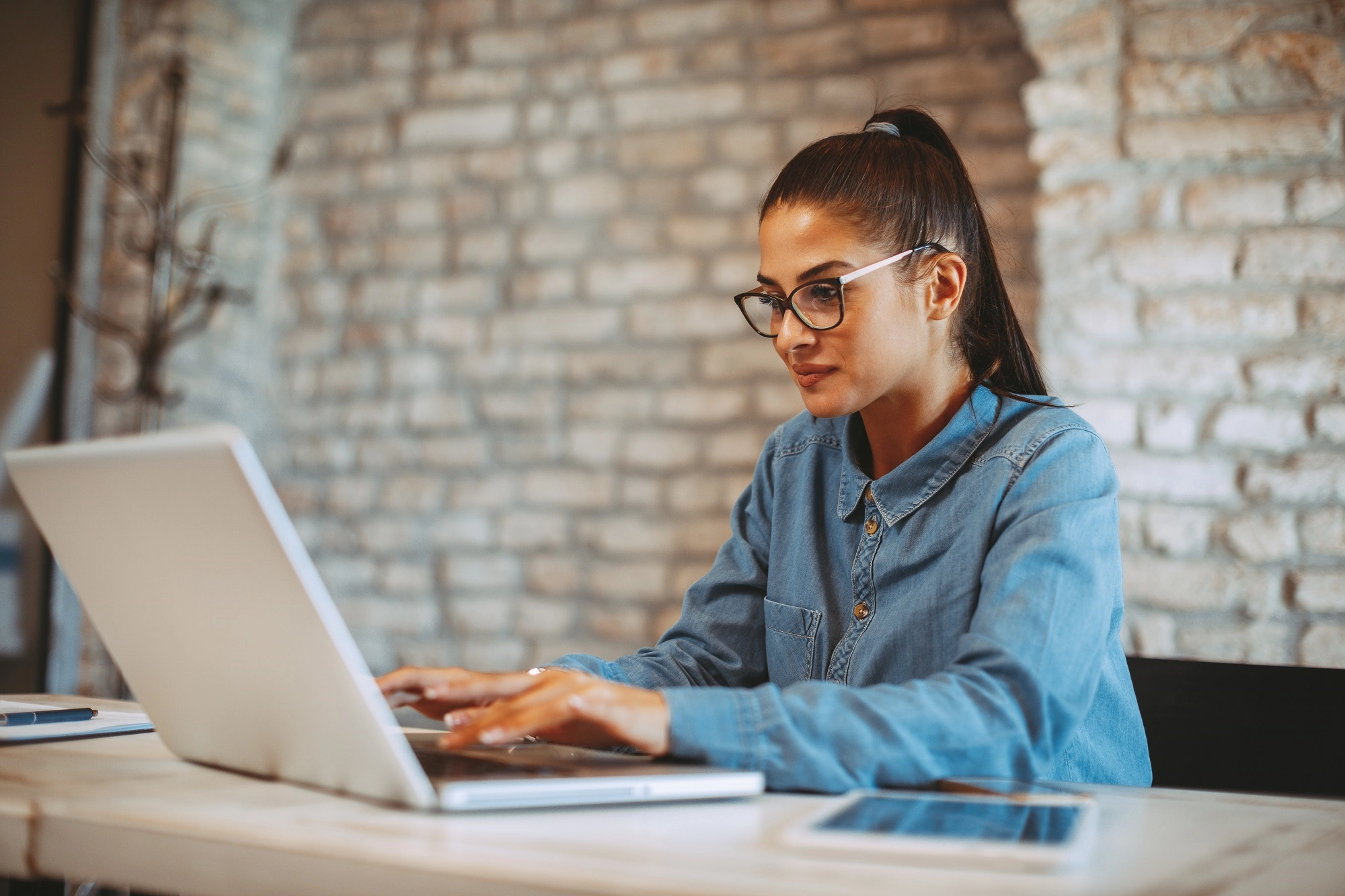 Young woman working on laptop in the office