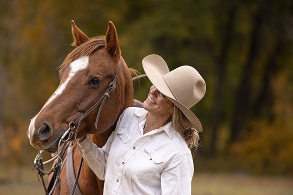 Happy woman with horse