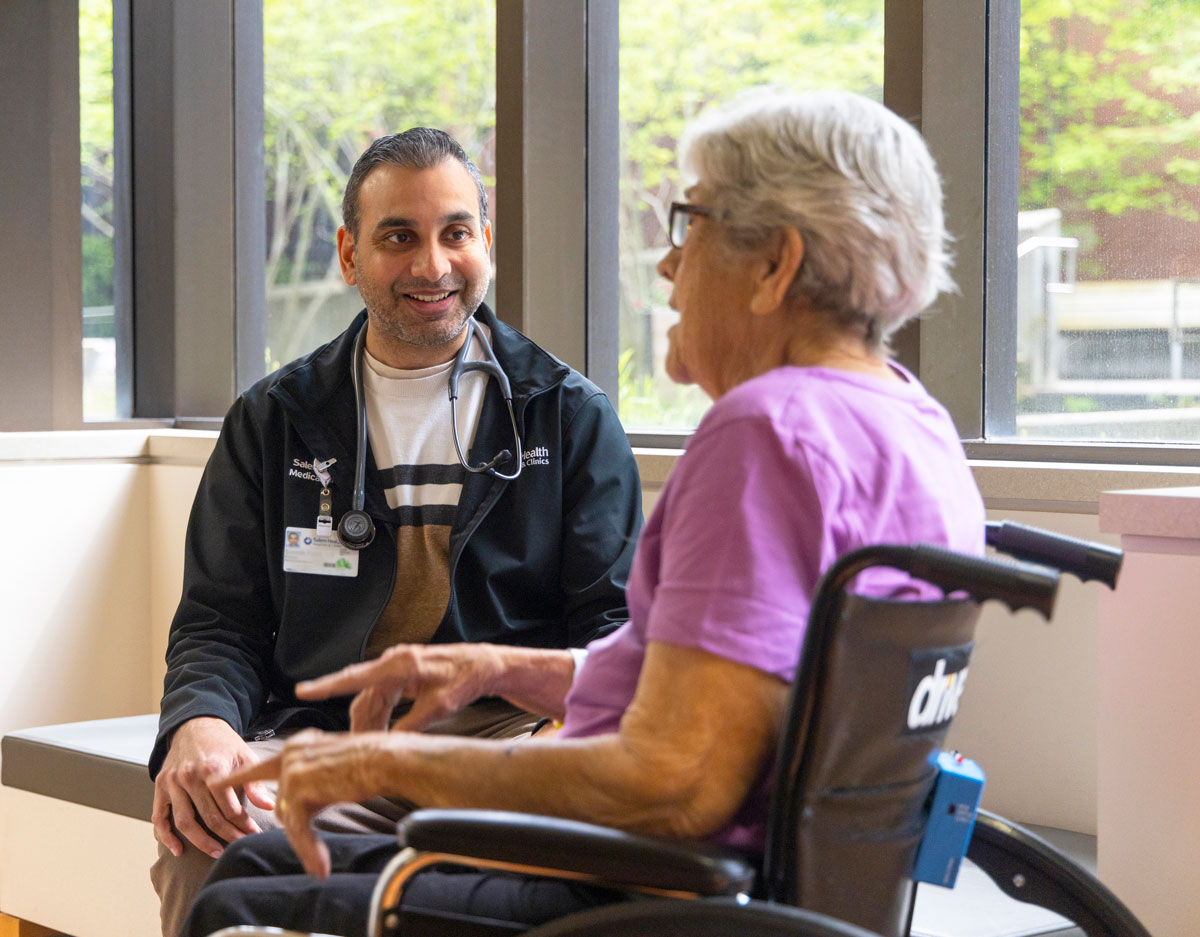 A rehab specialist with his patient at Salem Health.