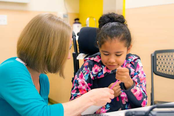 Therapist working with a child.