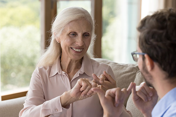Woman working with speech therapist