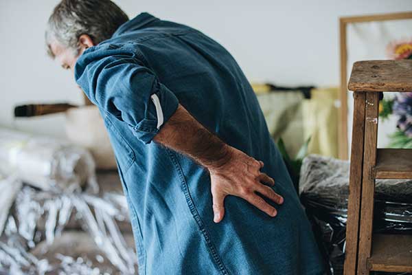 Man experiencing back pain.