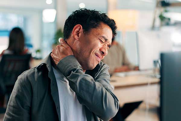 Man experiencing neck pain