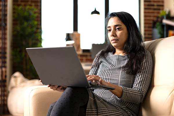 Woman researches pain management.