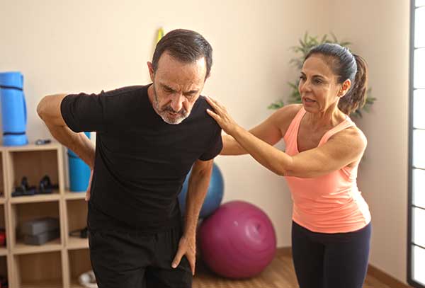 Couple strengthens their back muscles.