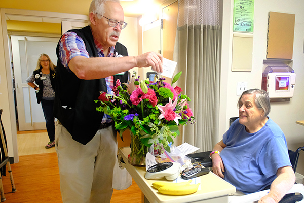 Access ambassador delivering flowers