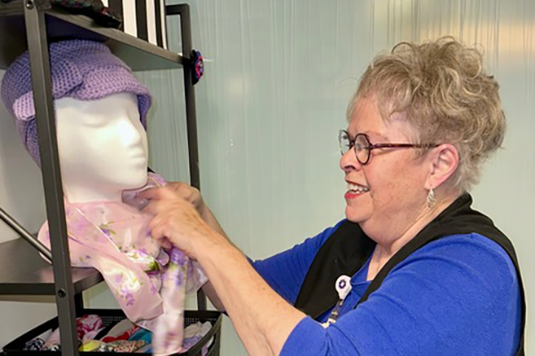 Volunteer helps in Cancer Resource Center