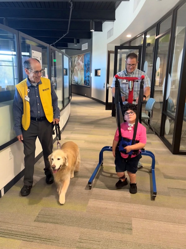 Axel Lopez_8x6 Eric Schuman and Kimber walk with Axel and PT Trent Tompkins