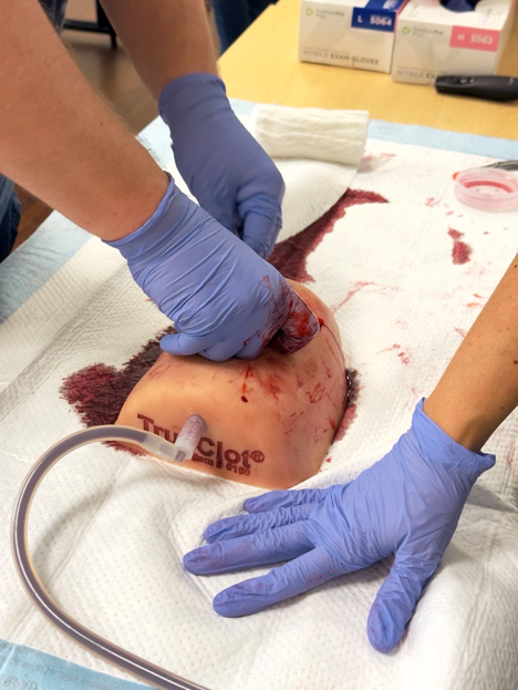 SHHC-2570_photo_Stop the Bleed first person_2 Packing a wet artificial wound