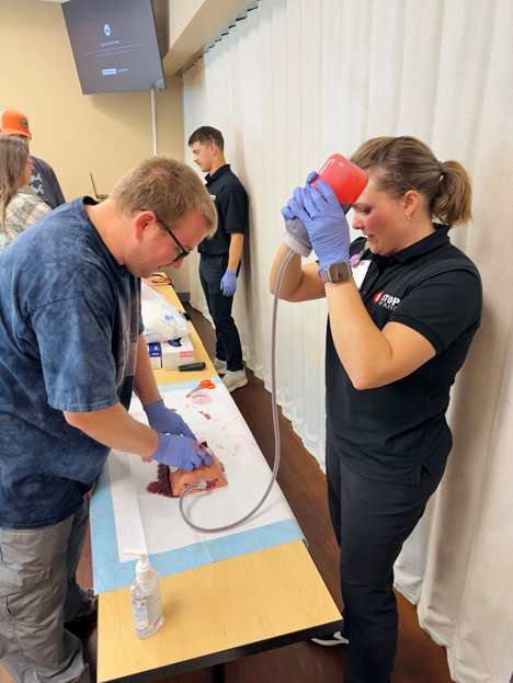 SHHC-2570_photo_Stop the Bleed first person_3 Packing a wet artificial wound